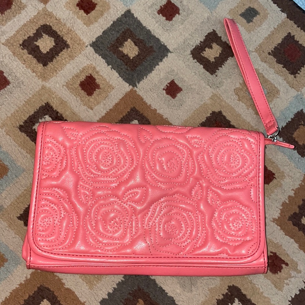 Coral colored clutch bag